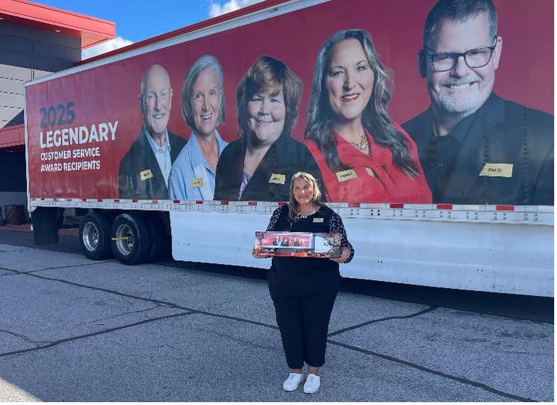 Carrie Todd is pictured Friday with the semi-trailer that now features her picture.